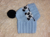 Handmade knitted panda hat for dachshund dog