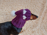 Knitted clothes dog hat with hearts for valentine's day