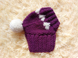Knitted clothes dog hat with hearts for valentine's day