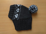 Gray handmade winter knitted hat with hearts for dogs