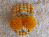 Winter hat for a dog with handmade pom-poms dachshundknit
