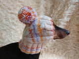 Warm winter snood hat for a dog with a pom-pom dachshundknit