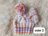Warm winter snood hat for a dog with a pom-pom dachshundknit