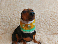 Warm knitted snood for pets with wooden buttons