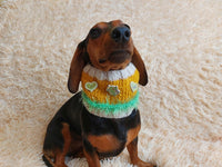 Warm knitted snood for pets with wooden buttons