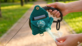 Dispenser of two rolled packs for dogs