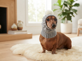 Gray dog hat knitted with natural pompom