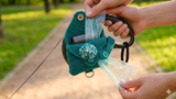 Dispenser of two rolled packs for dogs