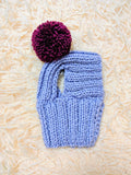 Hat for dog with pompom and holes for the ears