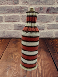 Knitted striped sweater for a bottle of wine
