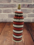 Knitted striped sweater for a bottle of wine