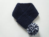 Knitted winter scarf for dog with pompom